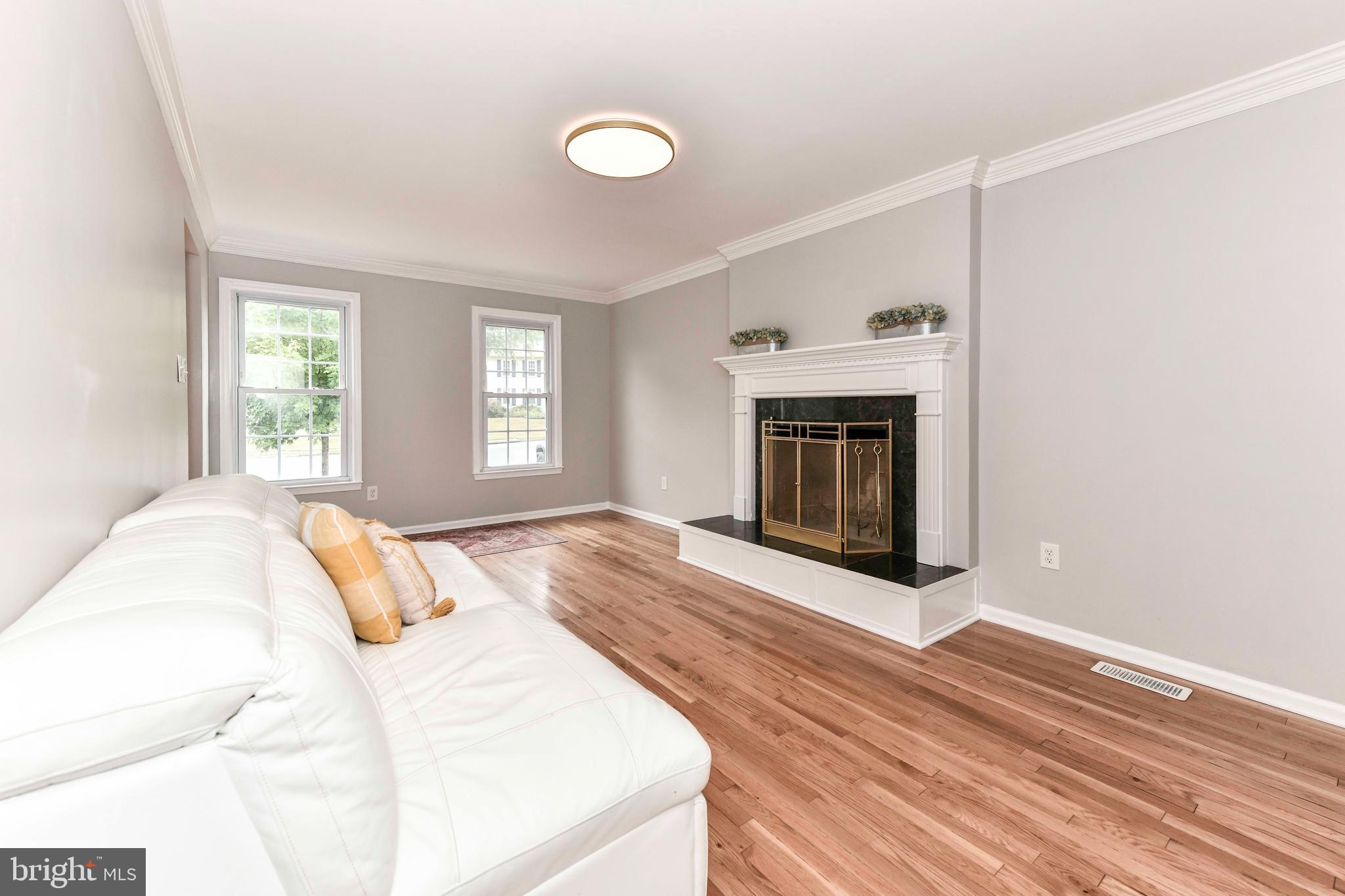 5500 Hampton Forest Way Clifton, VA 20124 - Photo 21 of 49 a bedroom with a bed and a fireplace