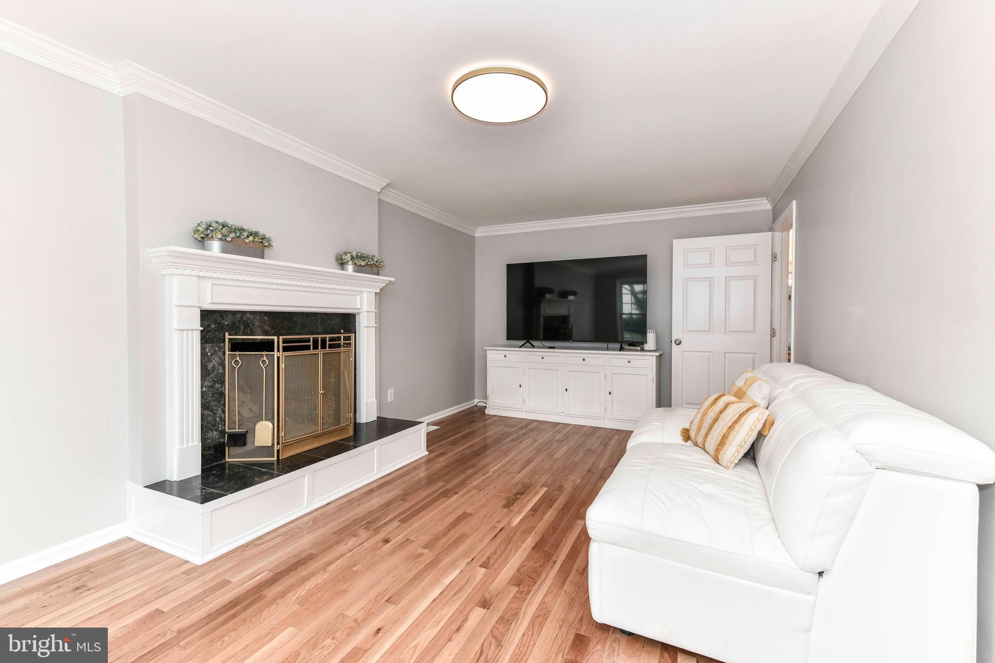 5500 Hampton Forest Way Clifton, VA 20124 - Photo 22 of 49 a bedroom with a bed and a fireplace