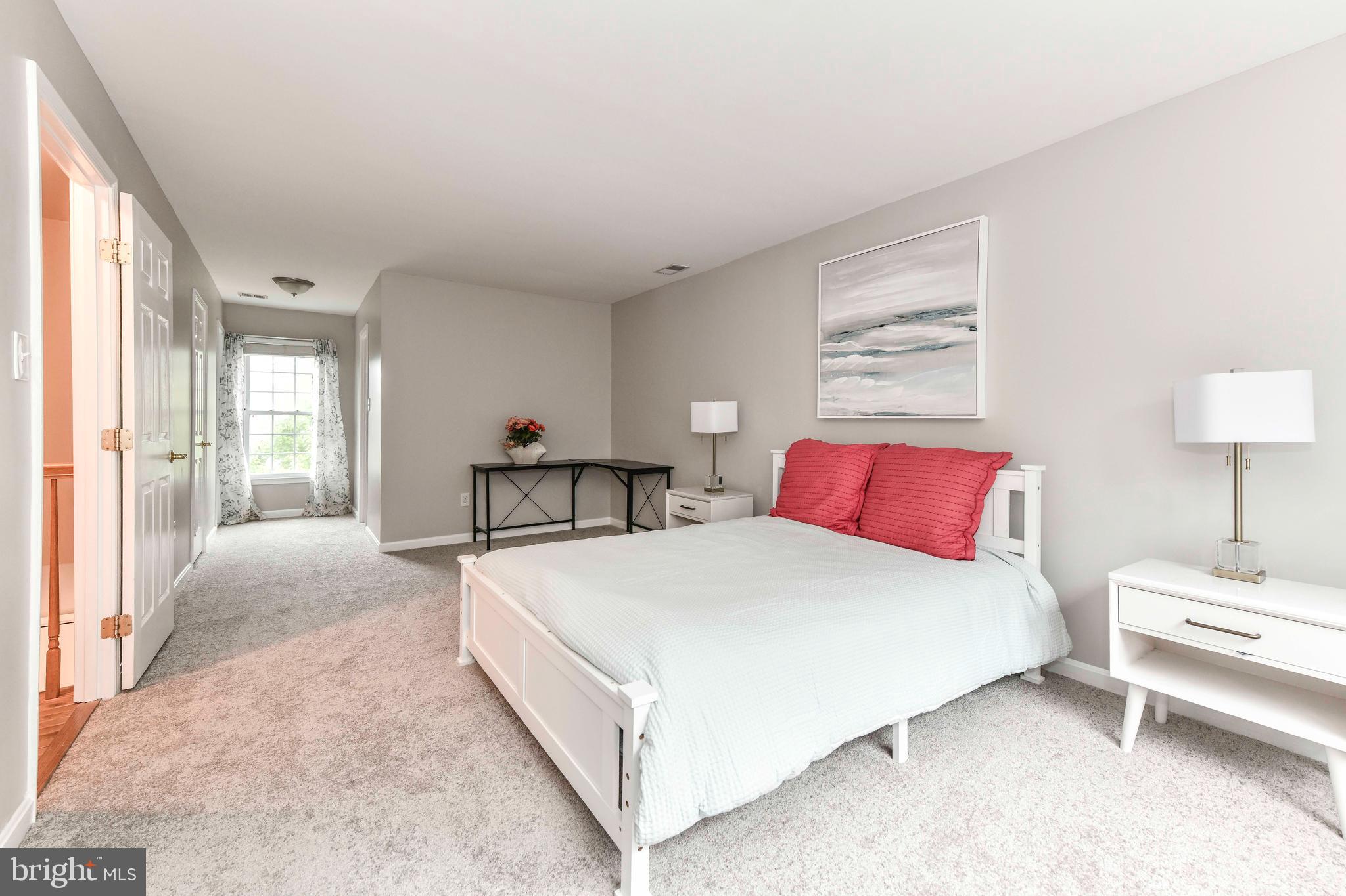 5500 Hampton Forest Way Clifton, VA 20124 - Photo 25 of 49 a bedroom with a bed and a lamp