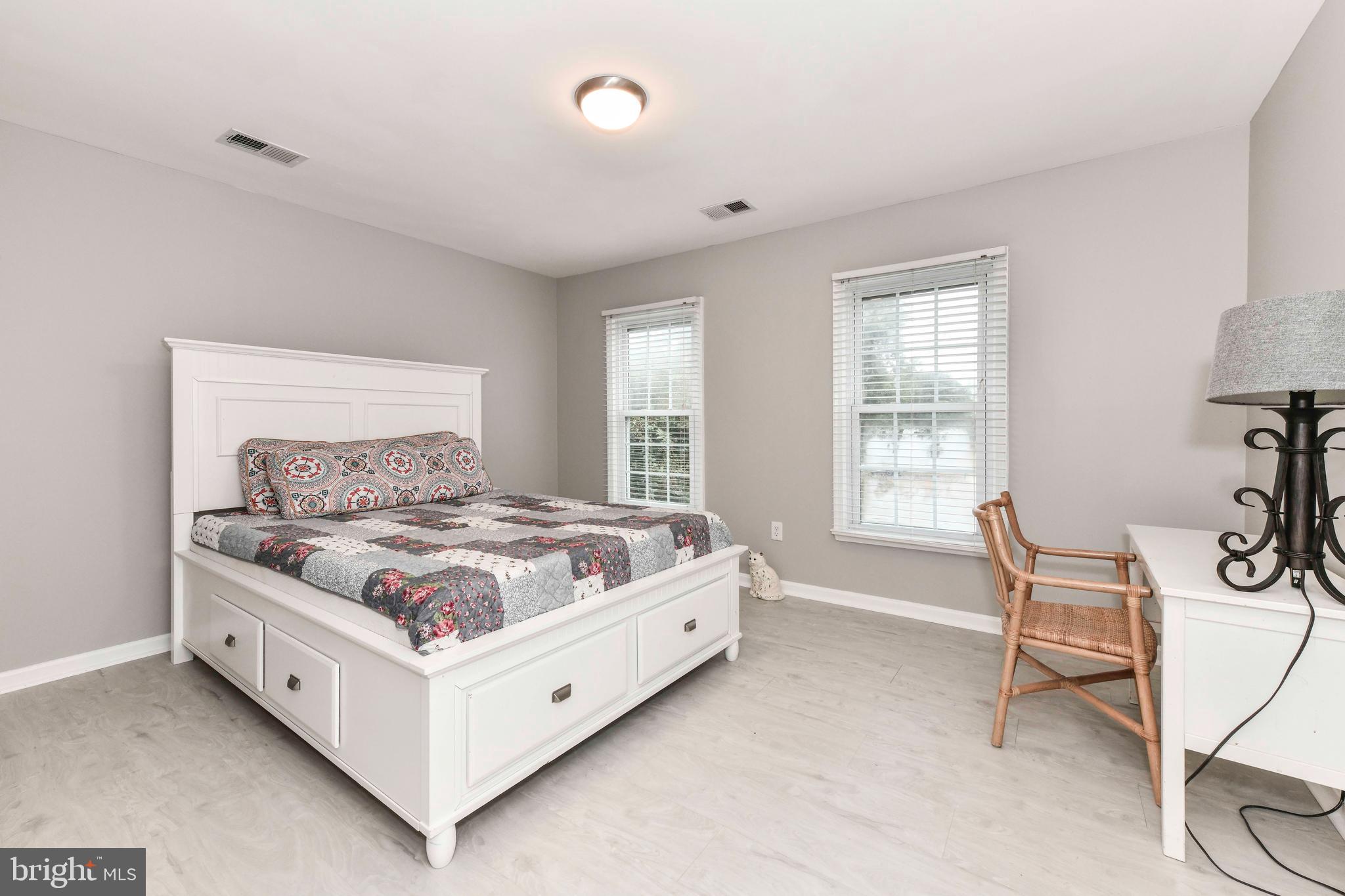 5500 Hampton Forest Way Clifton, VA 20124 - Photo 31 of 49 a bed sitting in a spacious bedroom next to a window