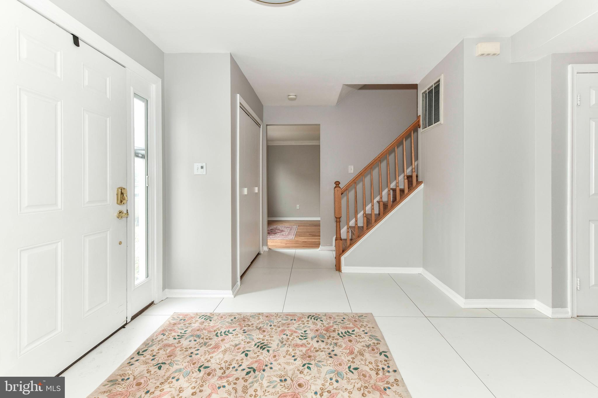 5500 Hampton Forest Way Clifton, VA 20124 - Photo 5 of 49 a view of entryway with stairs and wooden floor