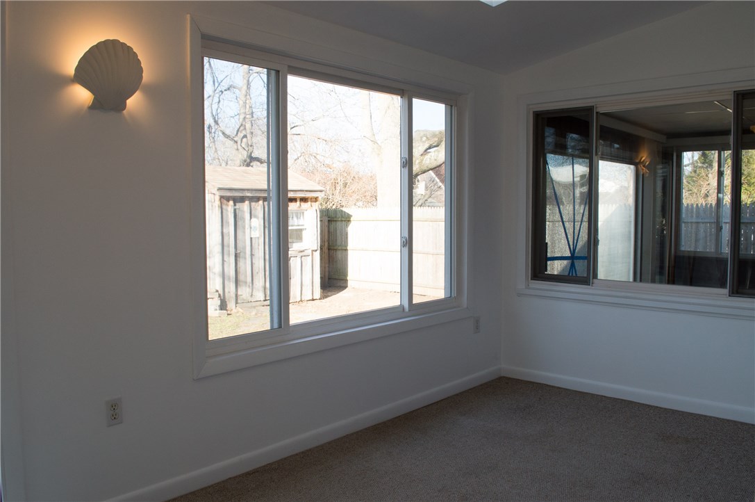 26 Pinehurst Road East Providence, RI 02915 - Photo 23 of 40 Sunroom overlooking back yard as well as window into bonus room