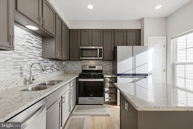a kitchen with a sink and cabinets