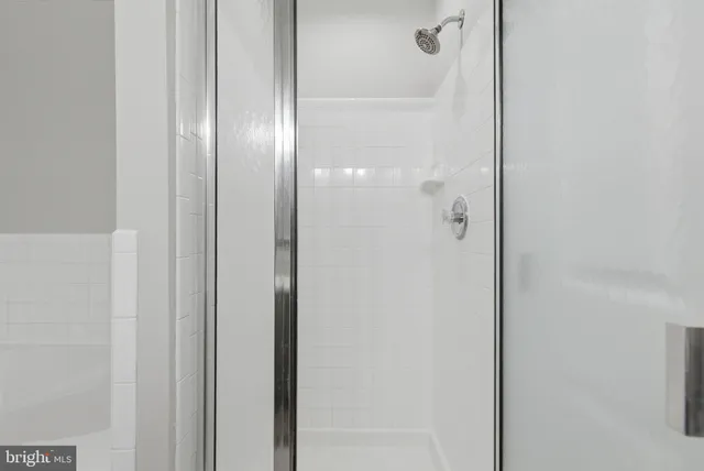 a bathroom with a granite countertop sink a toilet and a mirror