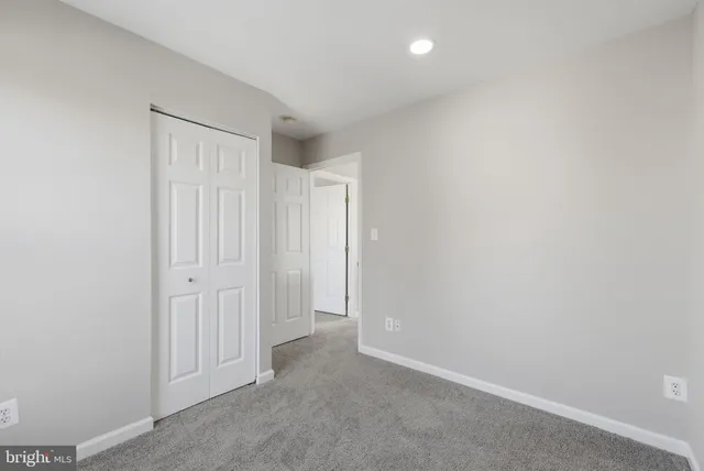 a view of an empty room with windows