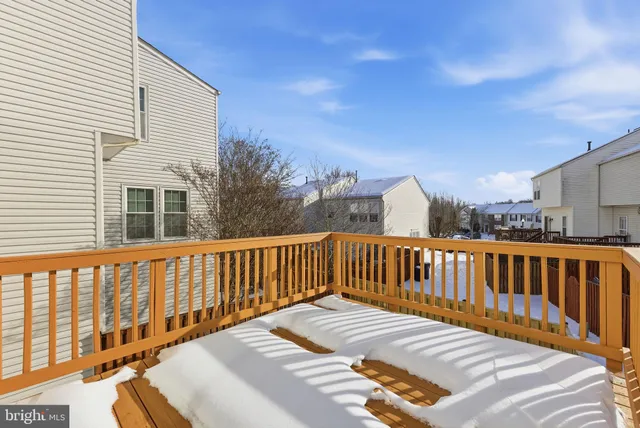 a balcony with view of wooden floor