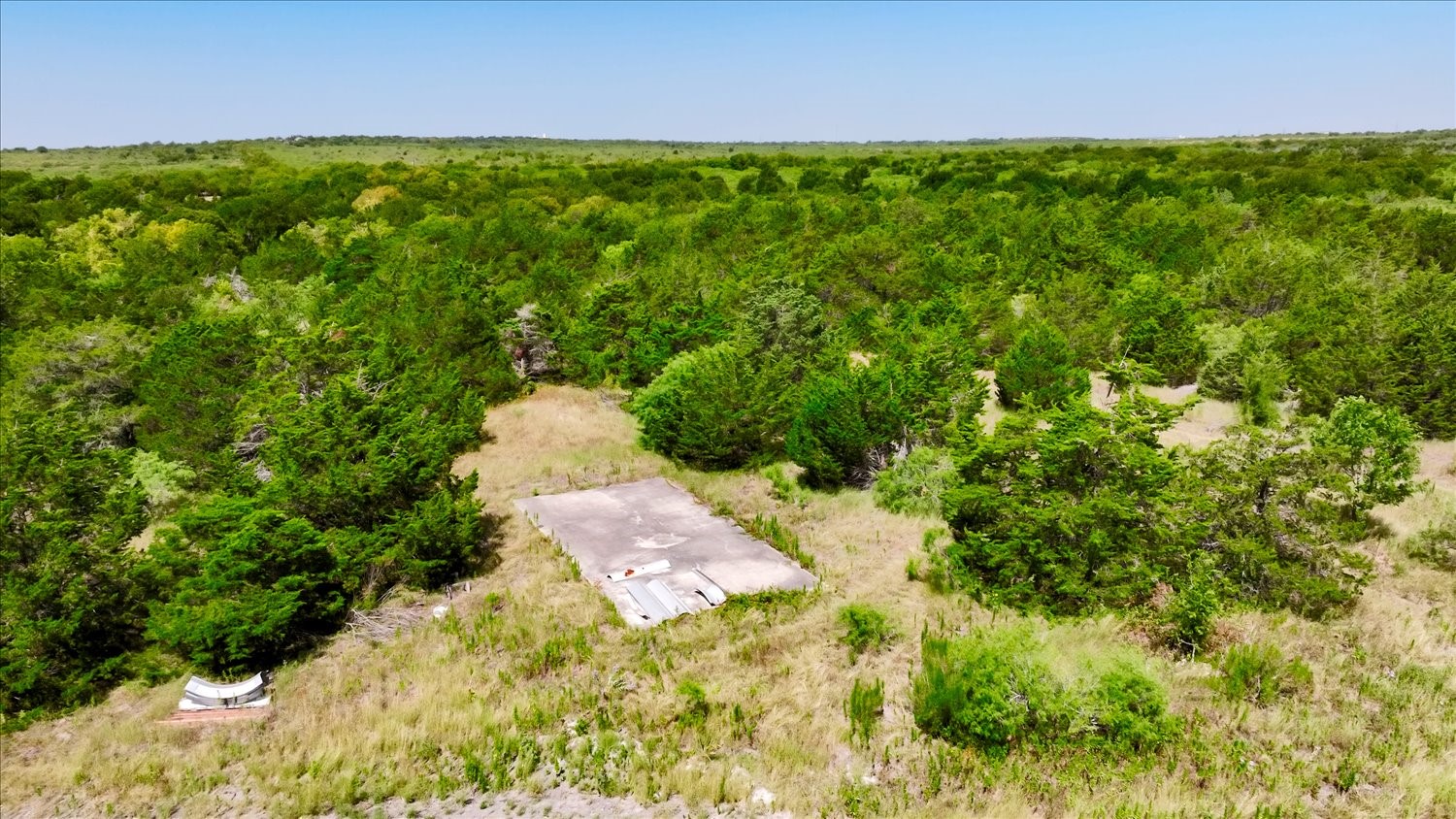 15000 Maha Road Austin, TX 78719 - Photo 12 of 16 a backyard of a house with lots of green space