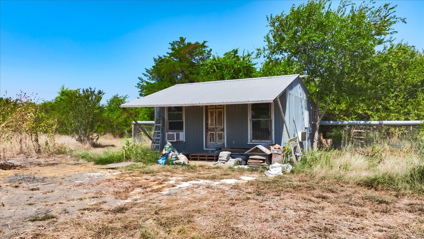 15000 Maha Road Austin, TX 78719 - Photo 15 of 16 a front view of a house with garden