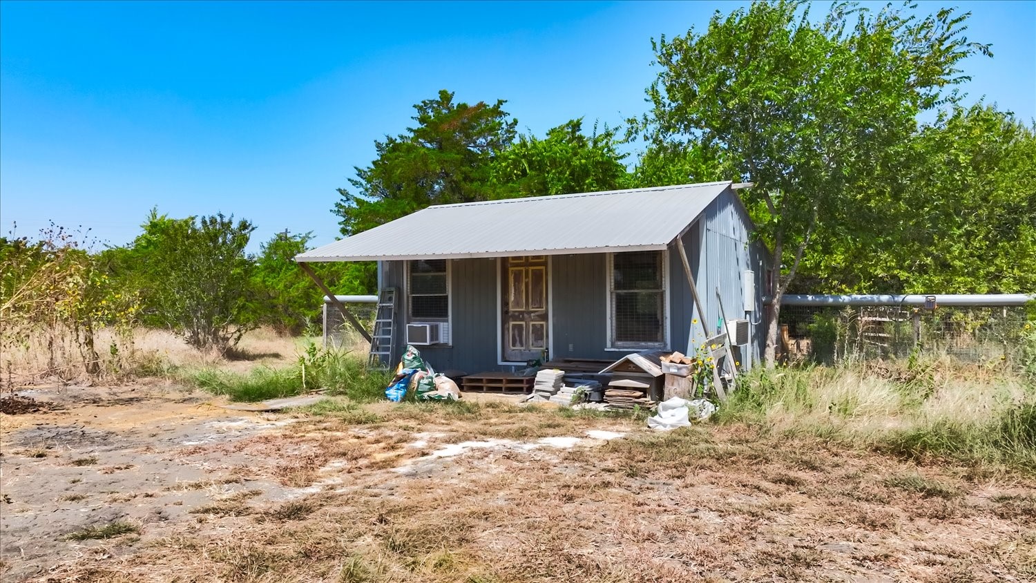 15000 Maha Road Austin, TX 78719 - Photo 15 of 16 a front view of a house with garden