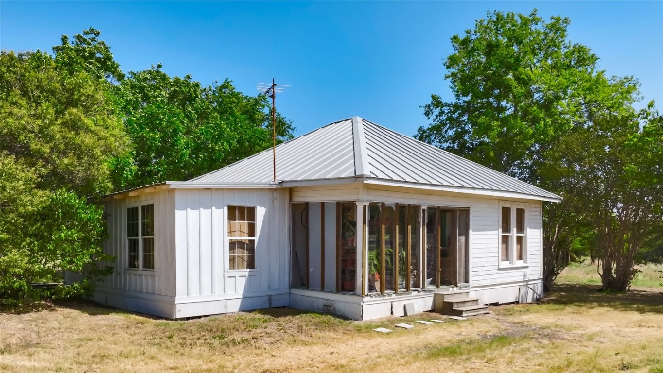 15000 Maha Road Austin, TX 78719 - Photo 16 of 16 a front view of a house with a yard