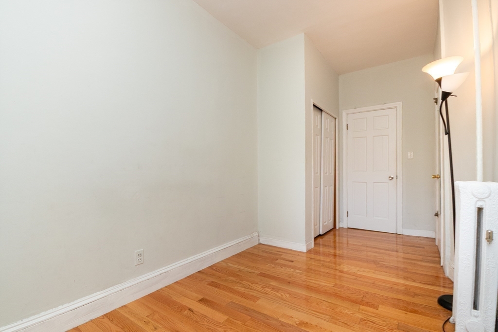 36 Winchester Street, Unit 6 Brookline, MA 02446 - Photo 11 of 20 a view of empty room with wooden floor