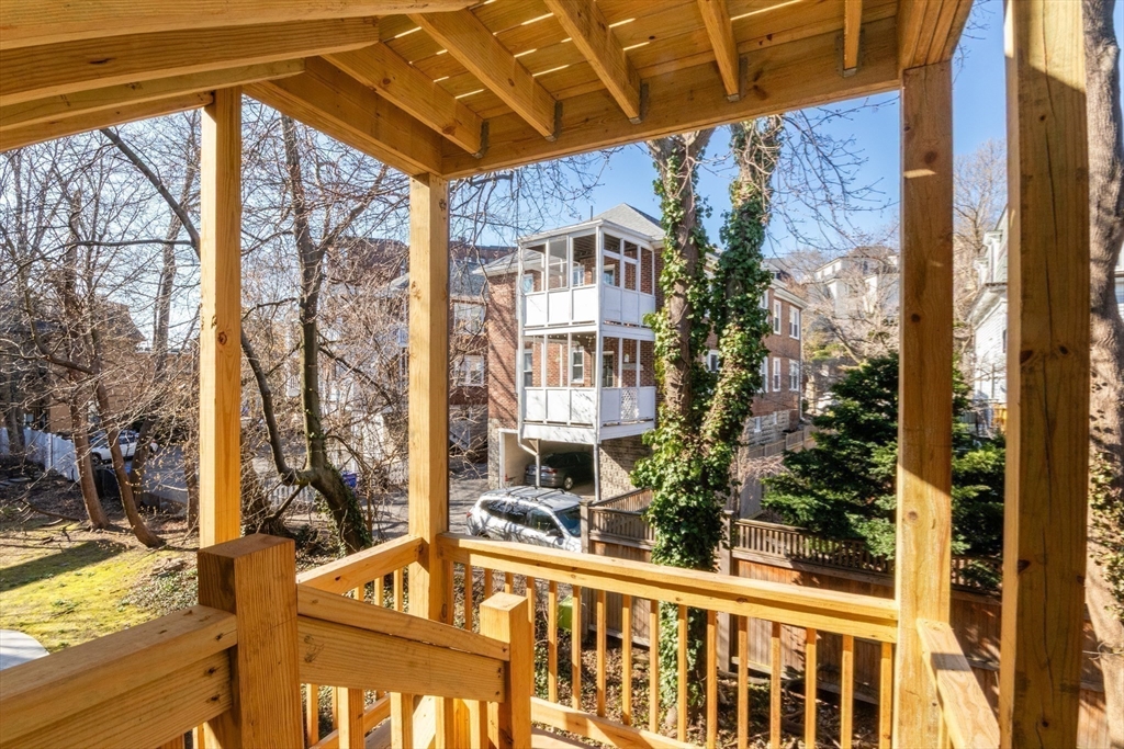 36 Winchester Street, Unit 6 Brookline, MA 02446 - Photo 17 of 20 a view of a balcony with wooden floor and outdoor space