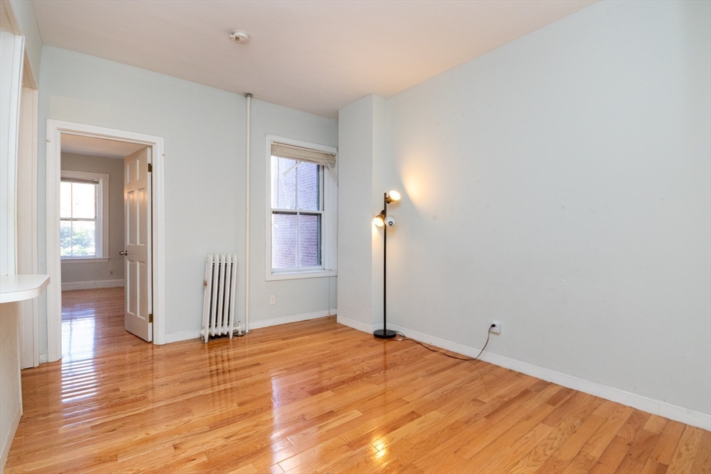 36 Winchester Street, Unit 6 Brookline, MA 02446 - Photo 2 of 20 a view of a room with wooden floor