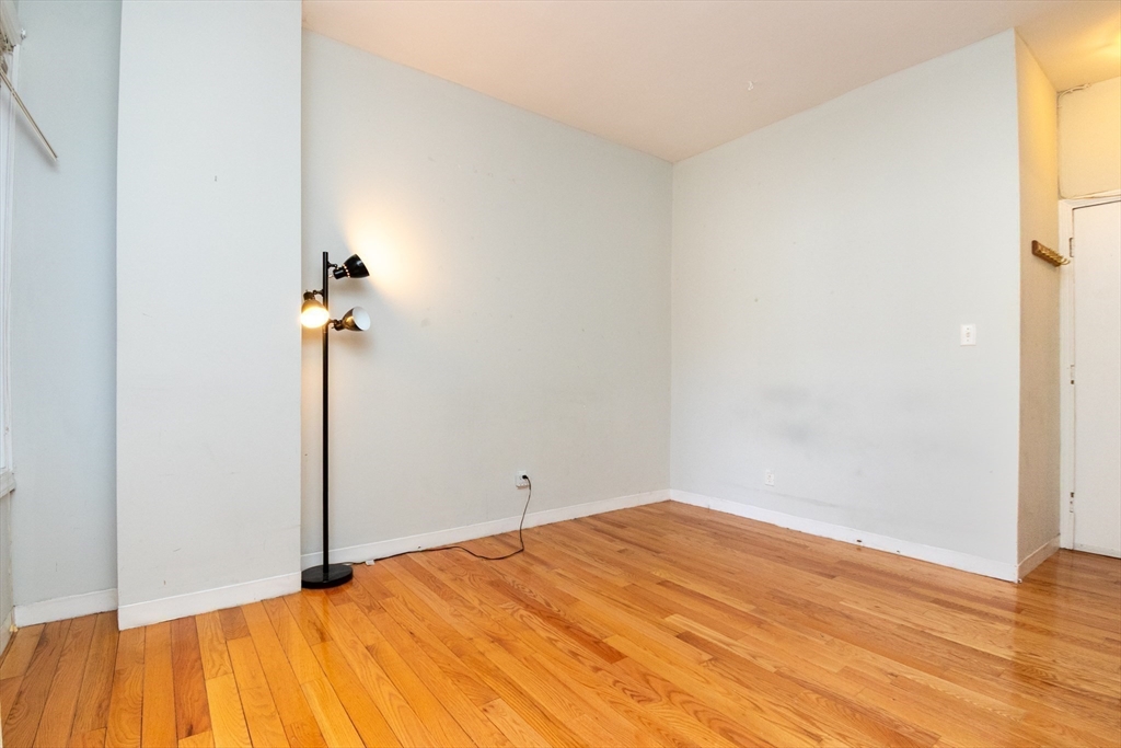 36 Winchester Street, Unit 6 Brookline, MA 02446 - Photo 4 of 20 a view of empty room with wooden floor