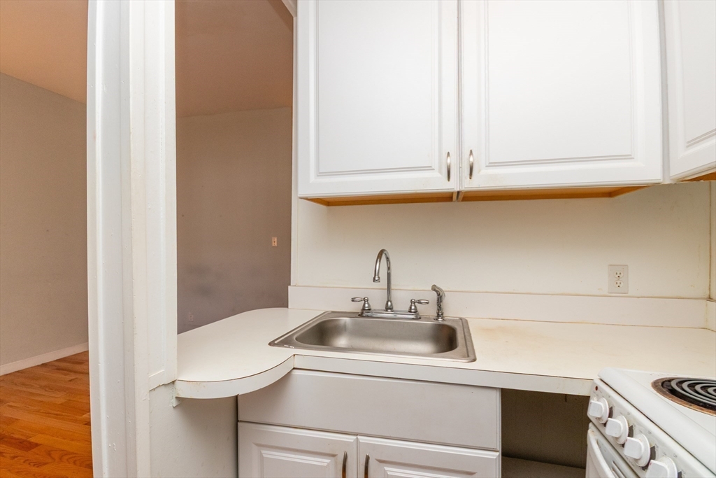36 Winchester Street, Unit 6 Brookline, MA 02446 - Photo 7 of 20 a bathroom with a sink and a mirror