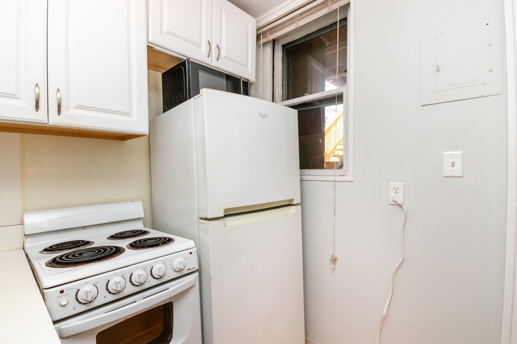 36 Winchester Street, Unit 6 Brookline, MA 02446 - Photo 9 of 20 a white refrigerator freezer and a stove