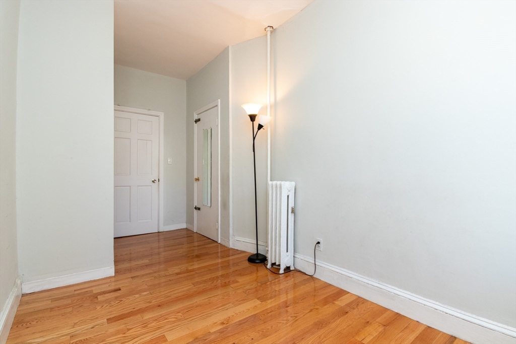 36 Winchester Street, Unit 6 Brookline, MA 02446 - Photo 10 of 20 a view of a room with wooden floor