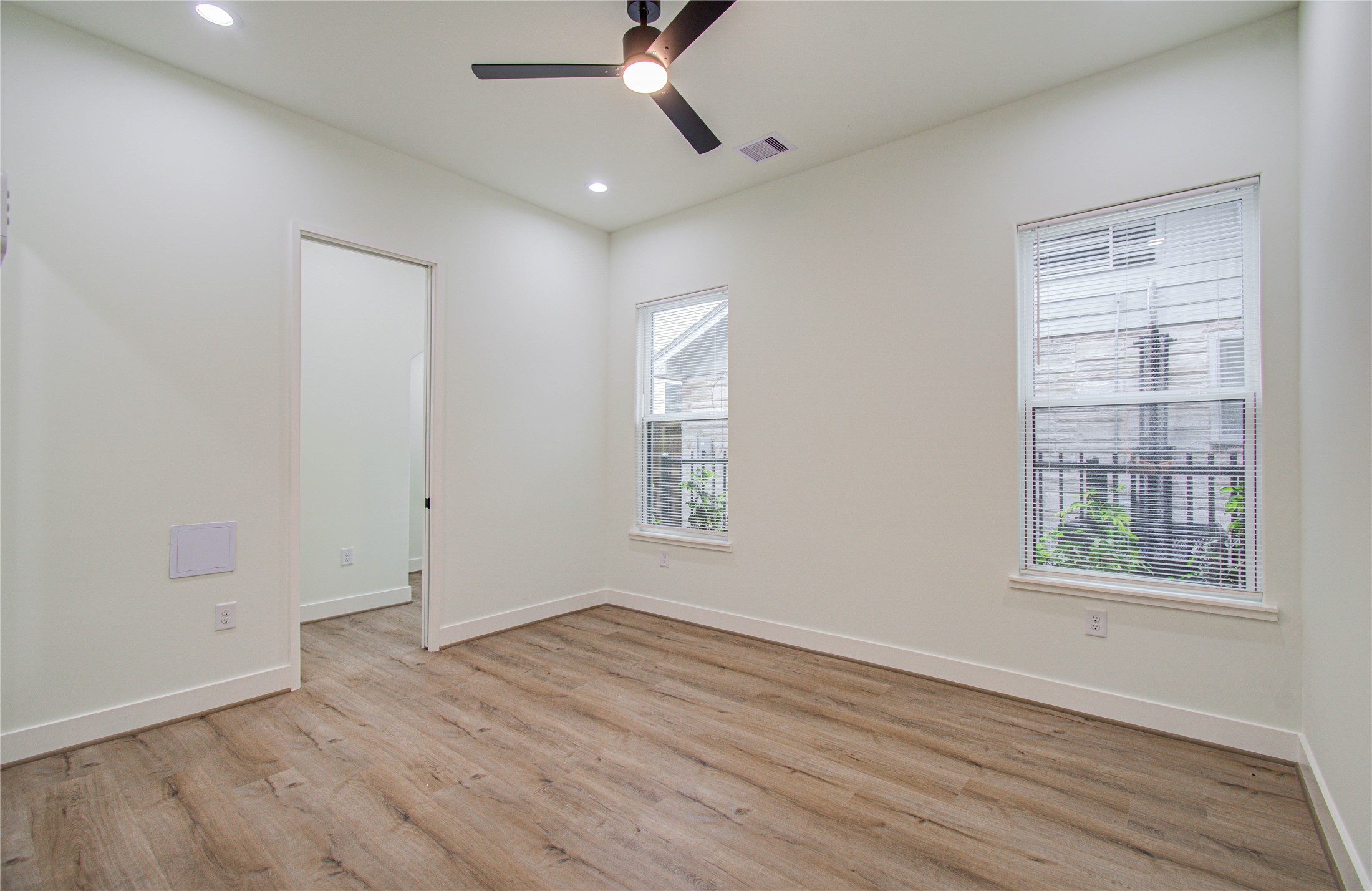 4603 Edison Street, Unit A Houston, TX 77009 - Photo 12 of 23 wooden floor in an empty room with a window