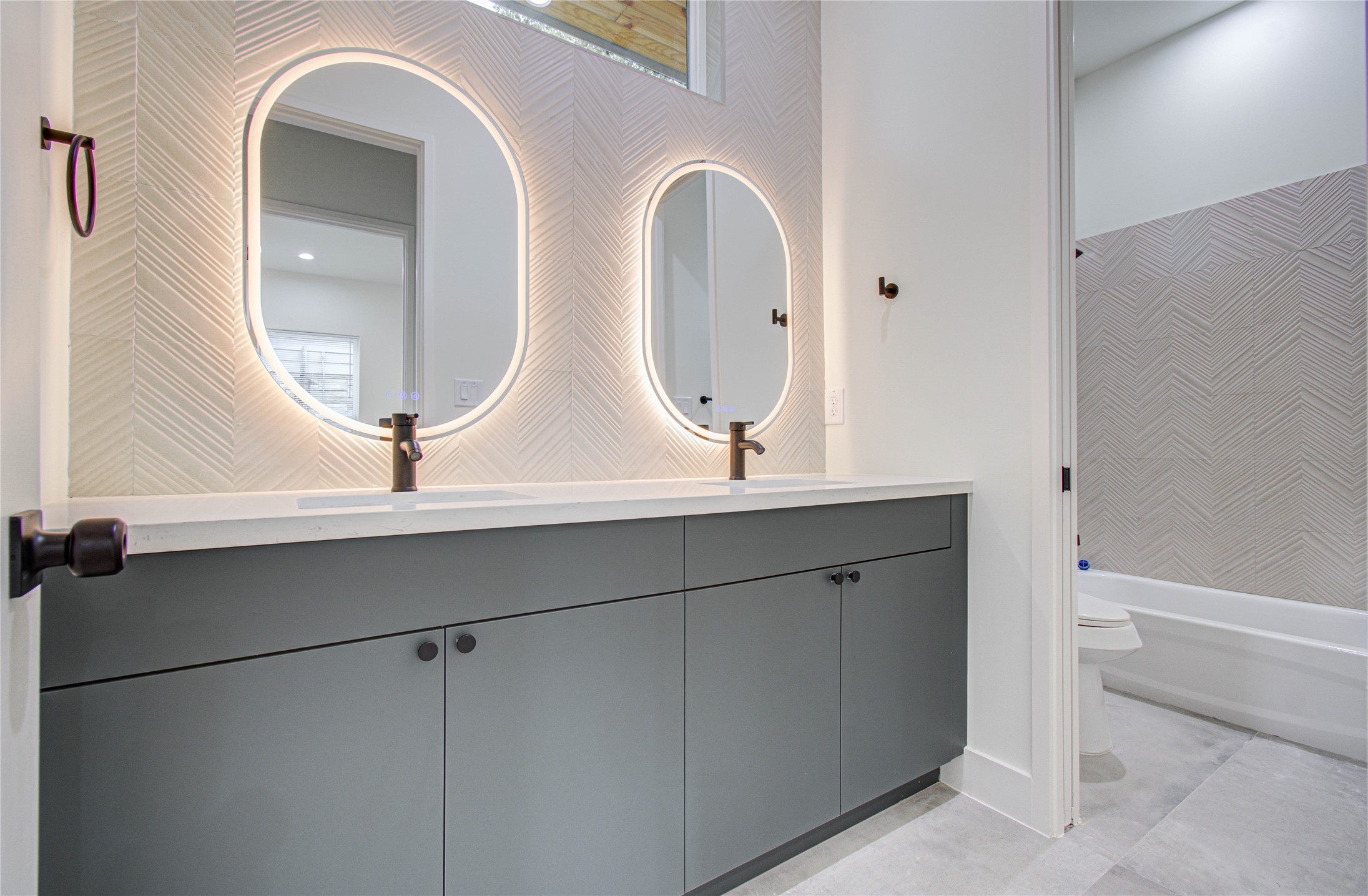 4603 Edison Street, Unit A Houston, TX 77009 - Photo 18 of 23 a bathroom with a double vanity sink and a mirror