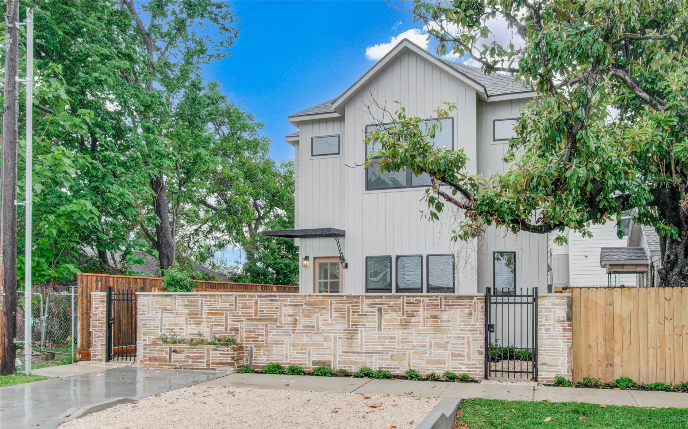 4603 Edison Street, Unit A Houston, TX 77009 - Photo 22 of 23 a front view of a house with a garden