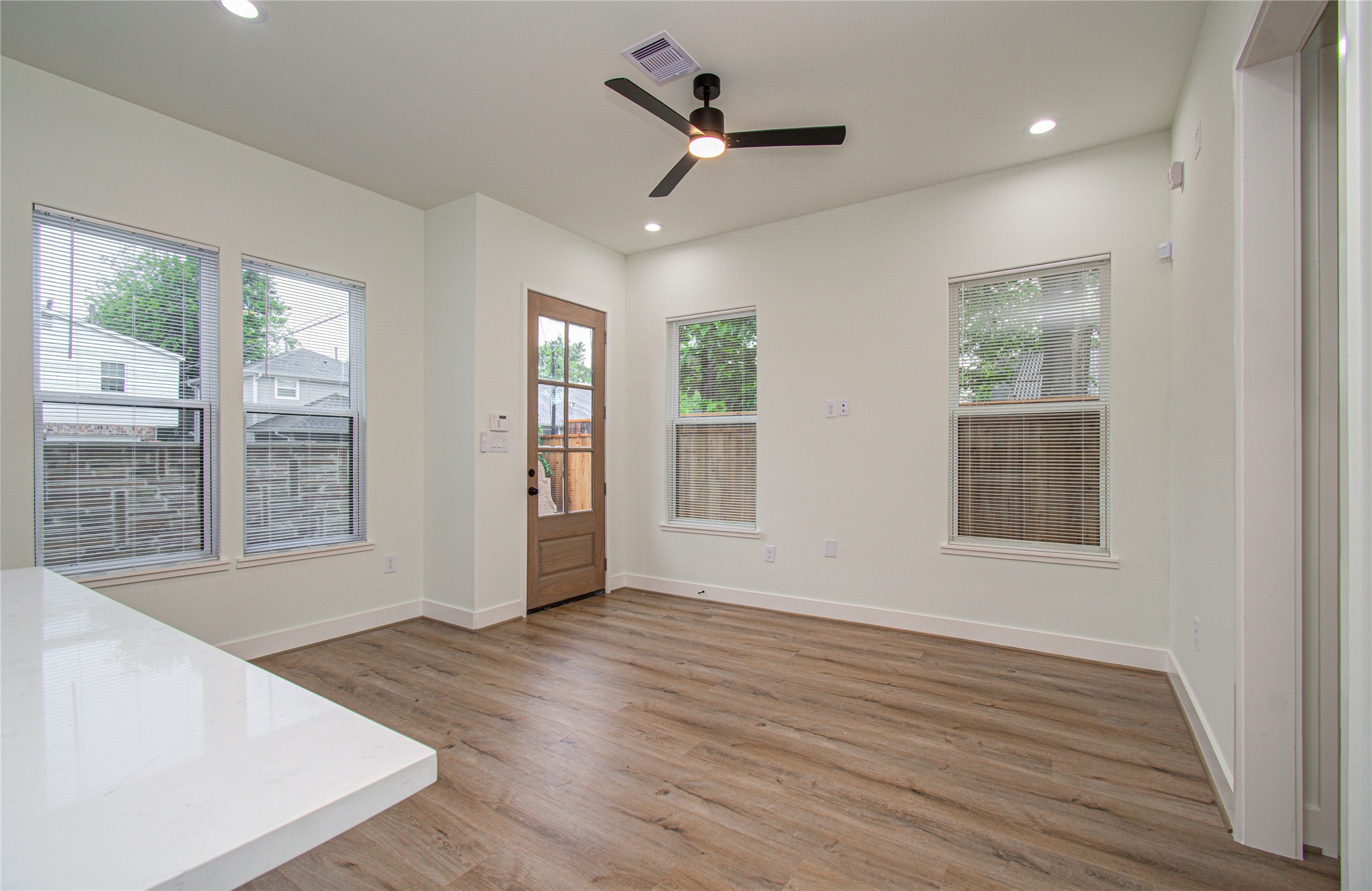 4603 Edison Street, Unit A Houston, TX 77009 - Photo 6 of 23 a view of an empty room with wooden floor and a window