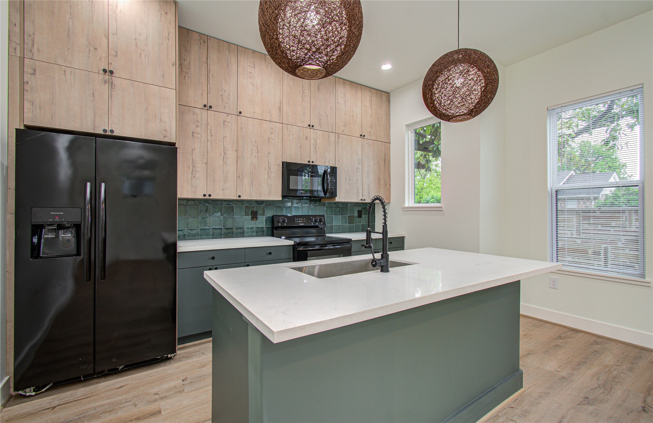 4603 Edison Street, Unit A Houston, TX 77009 - Photo 7 of 23 a kitchen with stainless steel appliances a large counter space cabinets and a window