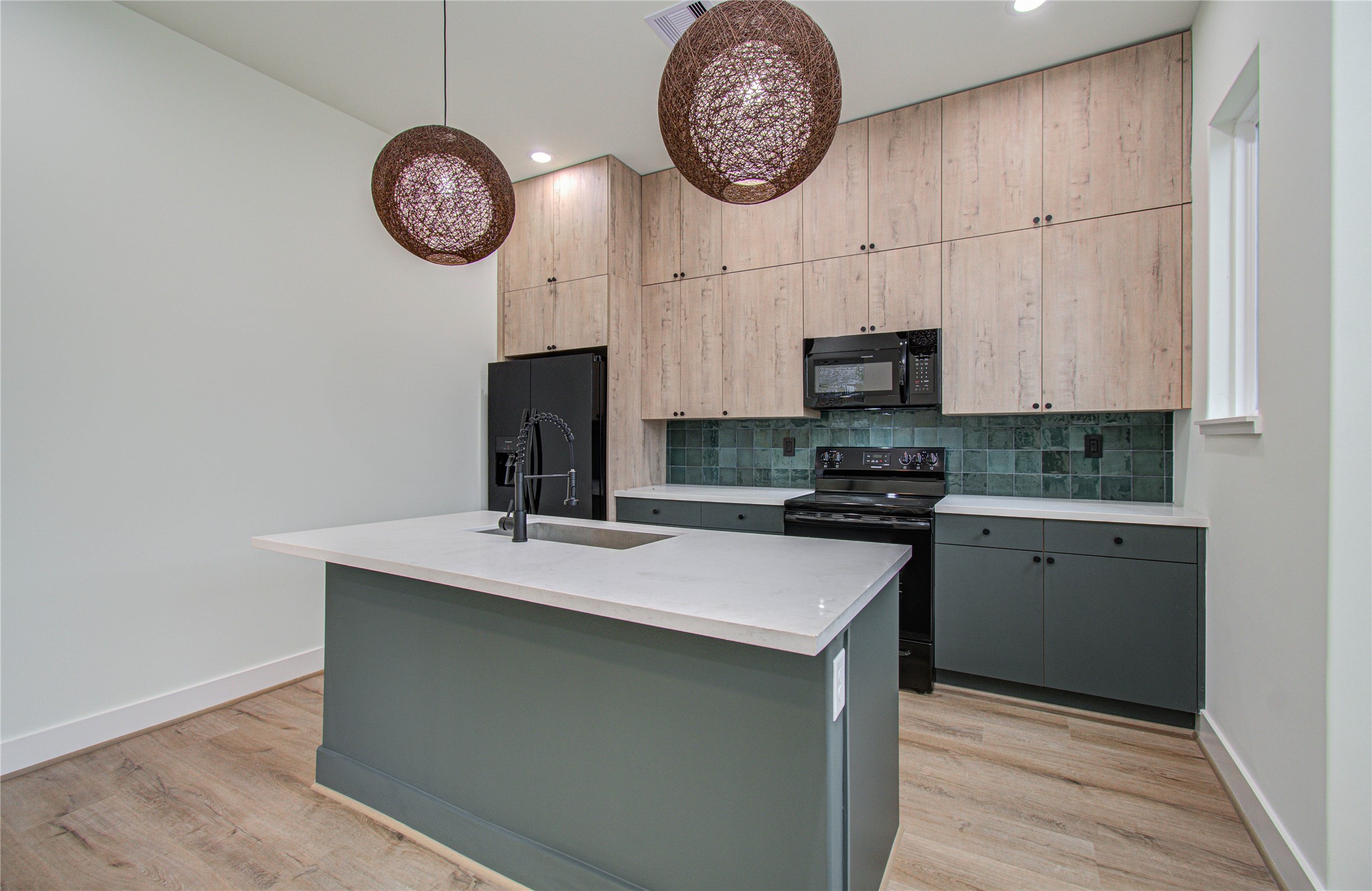 4603 Edison Street, Unit A Houston, TX 77009 - Photo 8 of 23 a kitchen with a stove and a clock