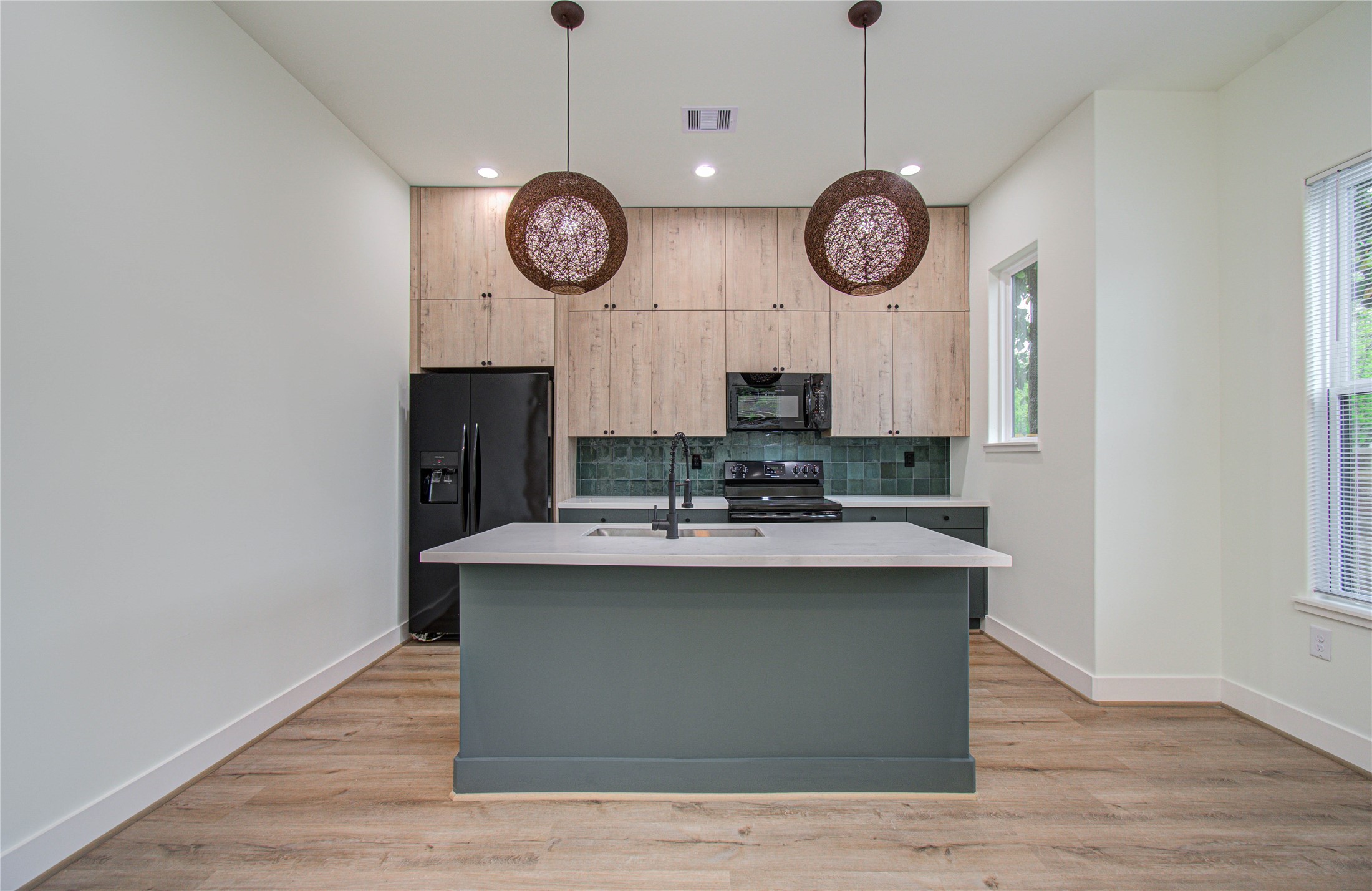 4603 Edison Street, Unit A Houston, TX 77009 - Photo 9 of 23 a view of a room with wooden floor and white wall