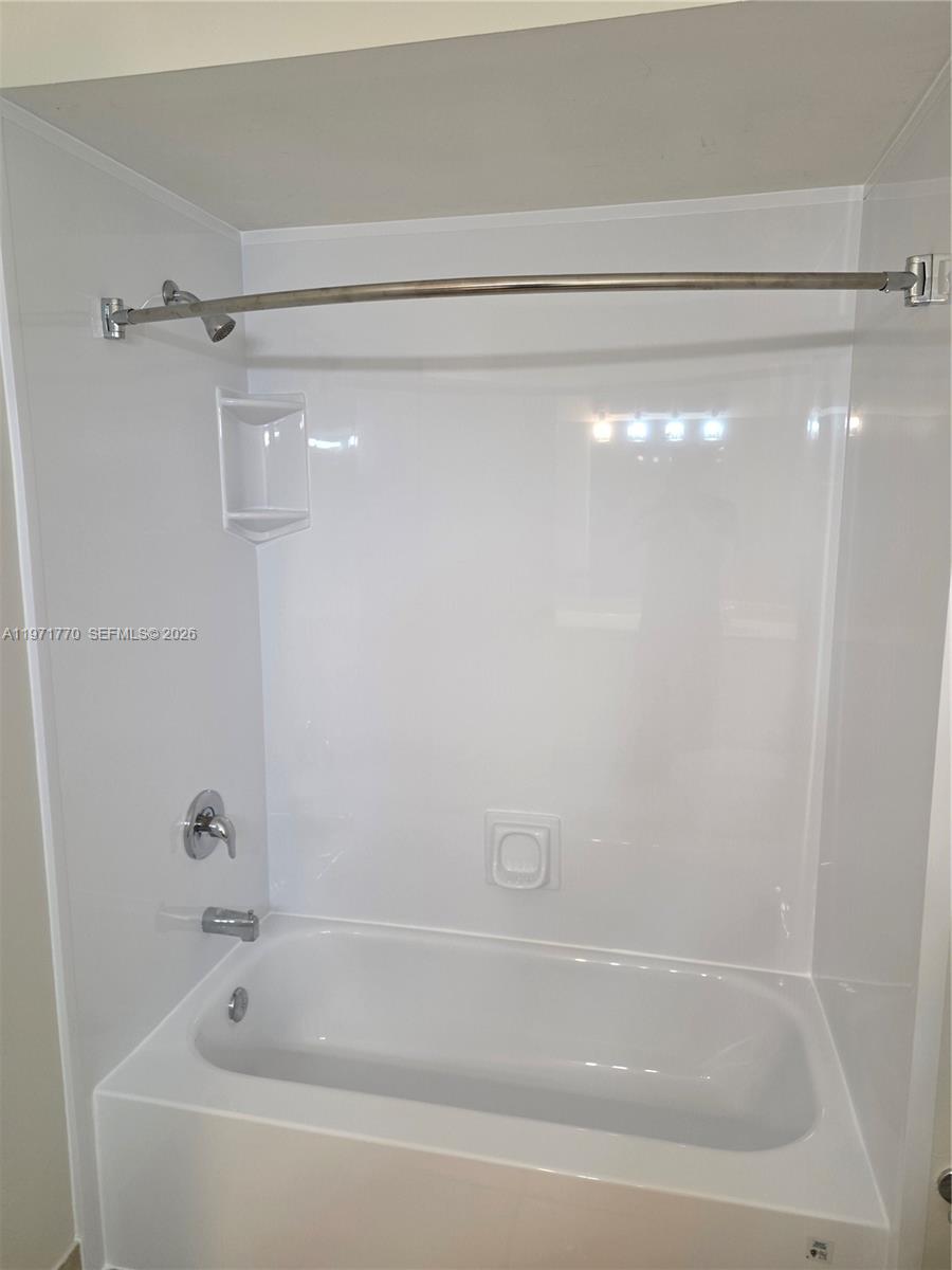 12490 Southwest 54th Street, Unit 12490 Miramar, FL 33027 - Photo 6 of 7 a close view of a bathtub in bathroom