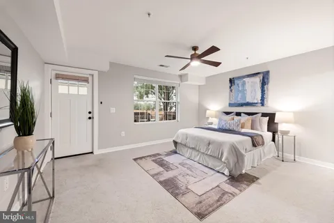 a bedroom with bed and window