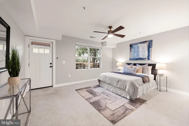 a bedroom with bed and window