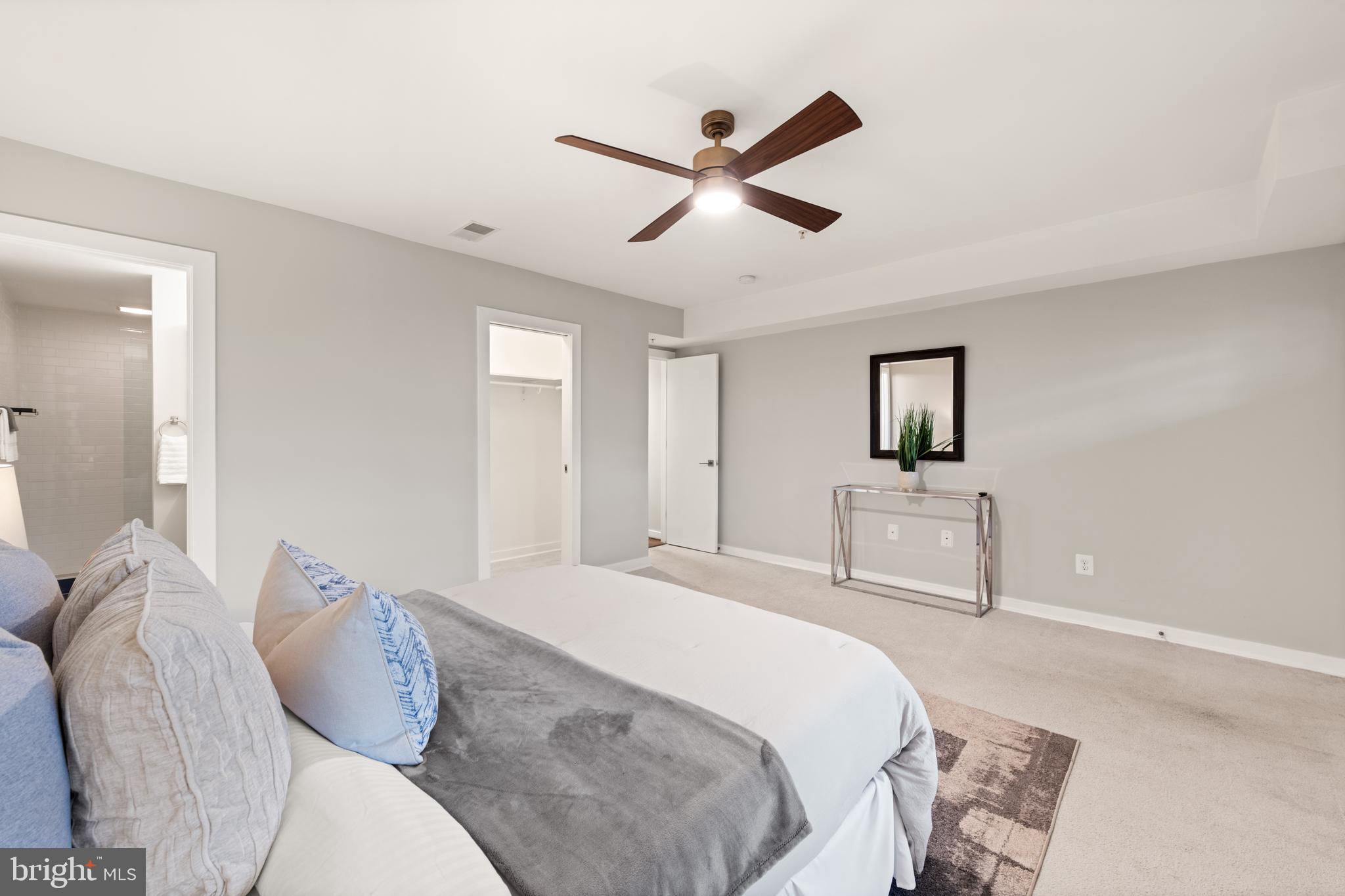 1812 D Street Northeast, Unit 1 Washington, DC 20002 - Photo 15 of 31 a bedroom with a bed and a painting on the wall