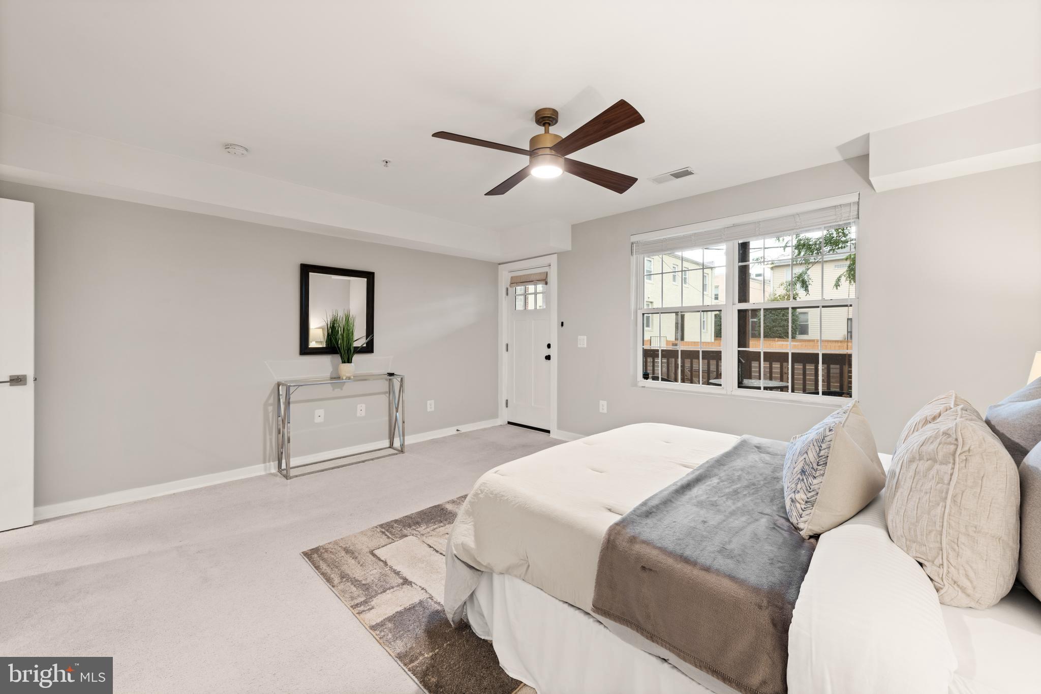 1812 D Street Northeast, Unit 1 Washington, DC 20002 - Photo 16 of 31 a spacious bedroom with a large bed and a window