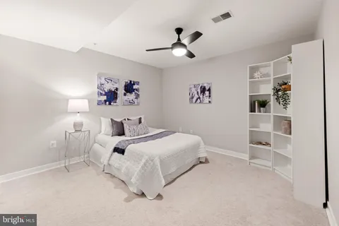 a bed room with a bed and a window