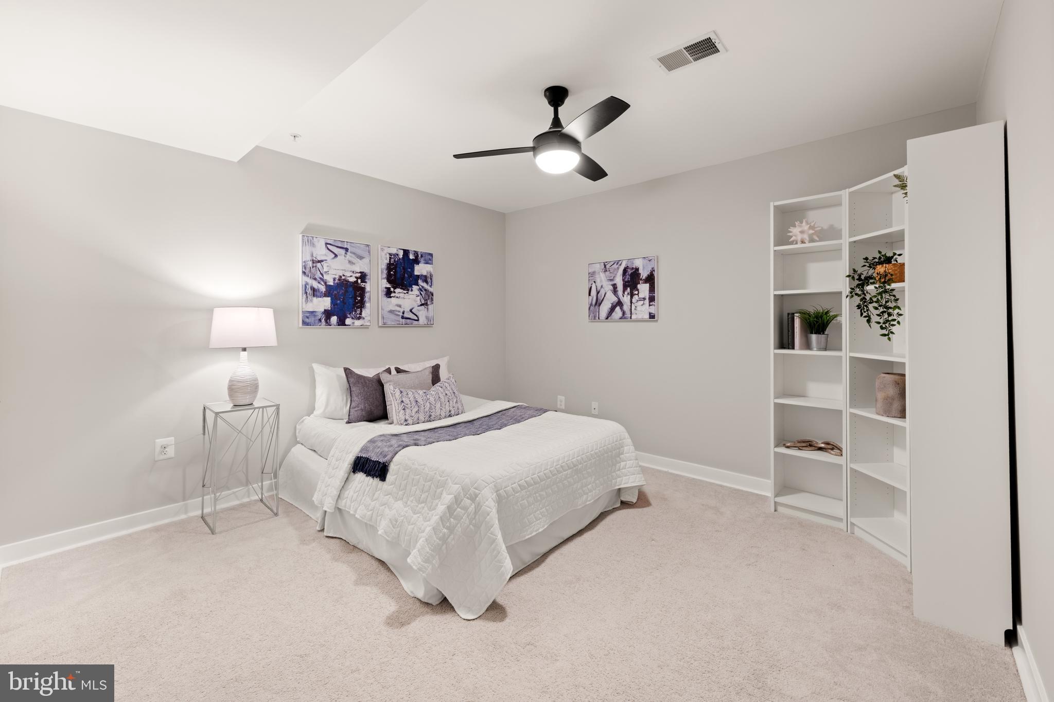 1812 D Street Northeast, Unit 1 Washington, DC 20002 - Photo 20 of 31 a bed room with a bed and a window