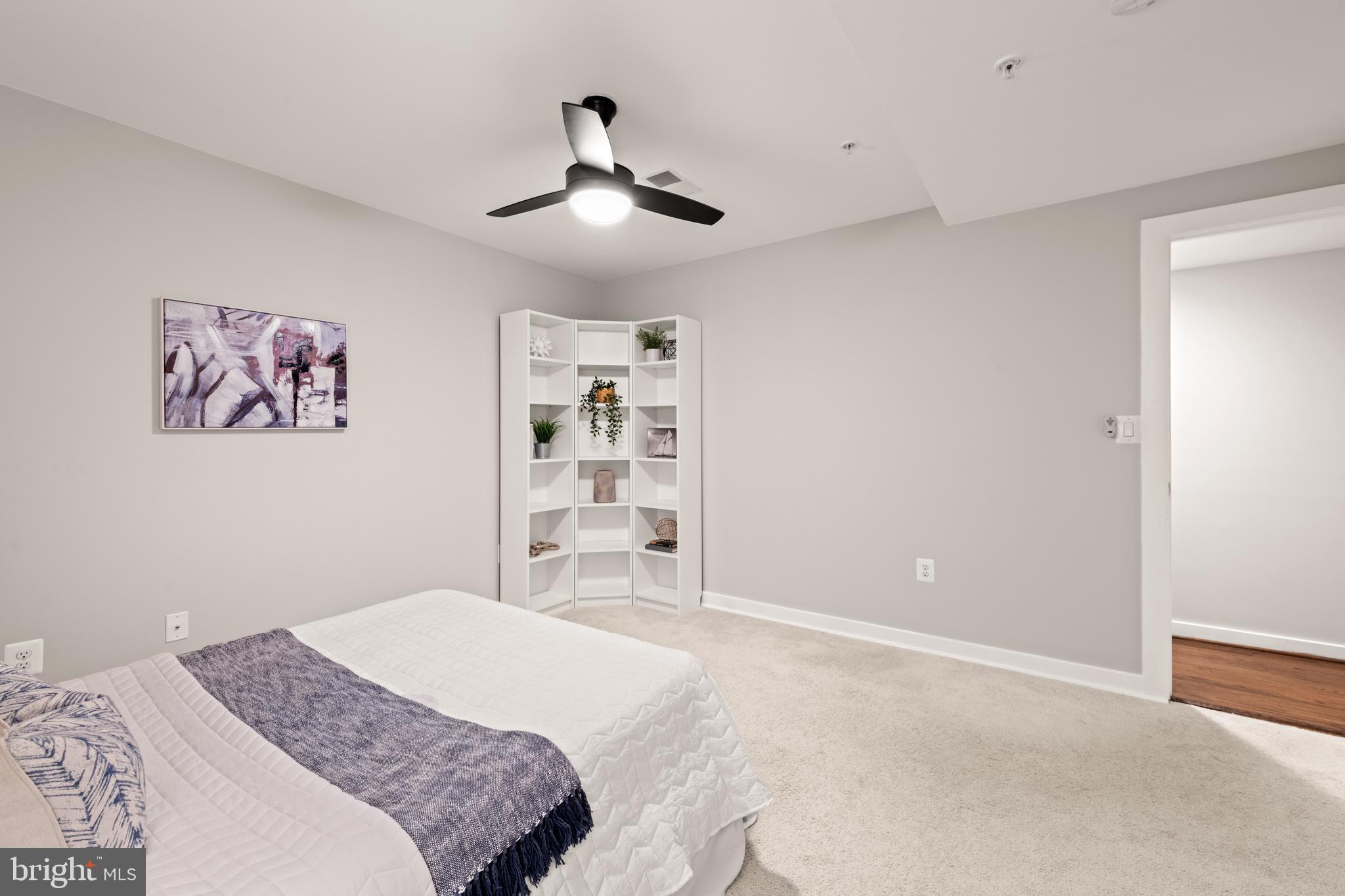 1812 D Street Northeast, Unit 1 Washington, DC 20002 - Photo 21 of 31 a bedroom with a large bed and a chandelier