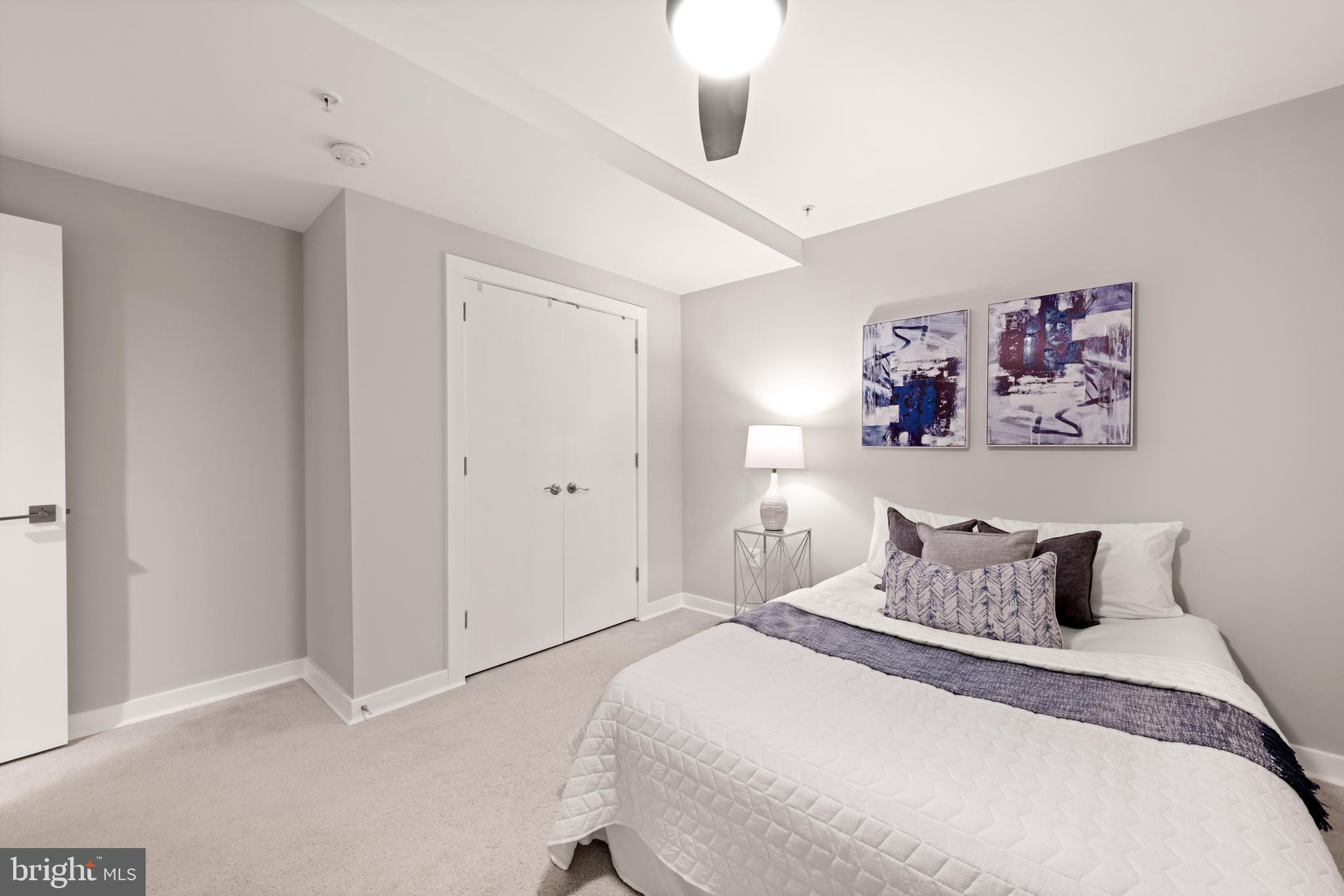 1812 D Street Northeast, Unit 1 Washington, DC 20002 - Photo 22 of 31 a bedroom with a bed and painting on the wall