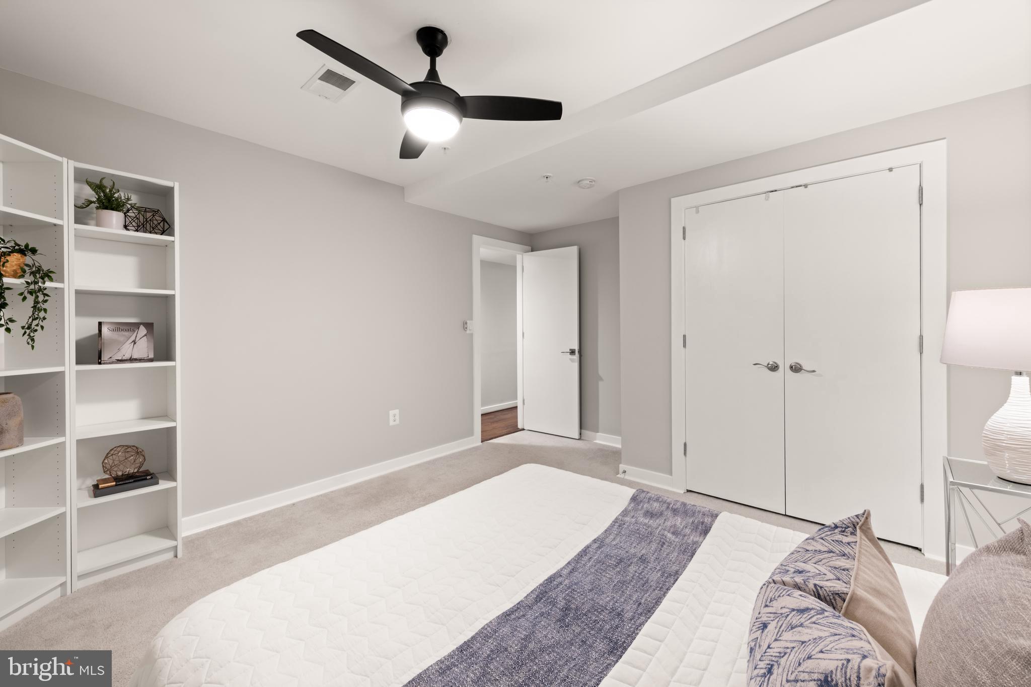 1812 D Street Northeast, Unit 1 Washington, DC 20002 - Photo 23 of 31 a bedroom with a large bed and a chandelier