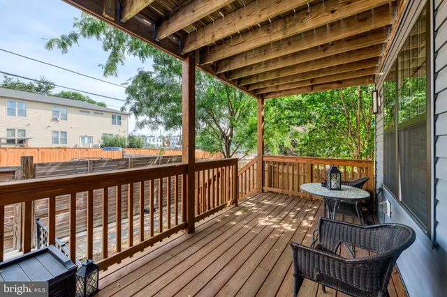a view of a chairs and table in the balcony