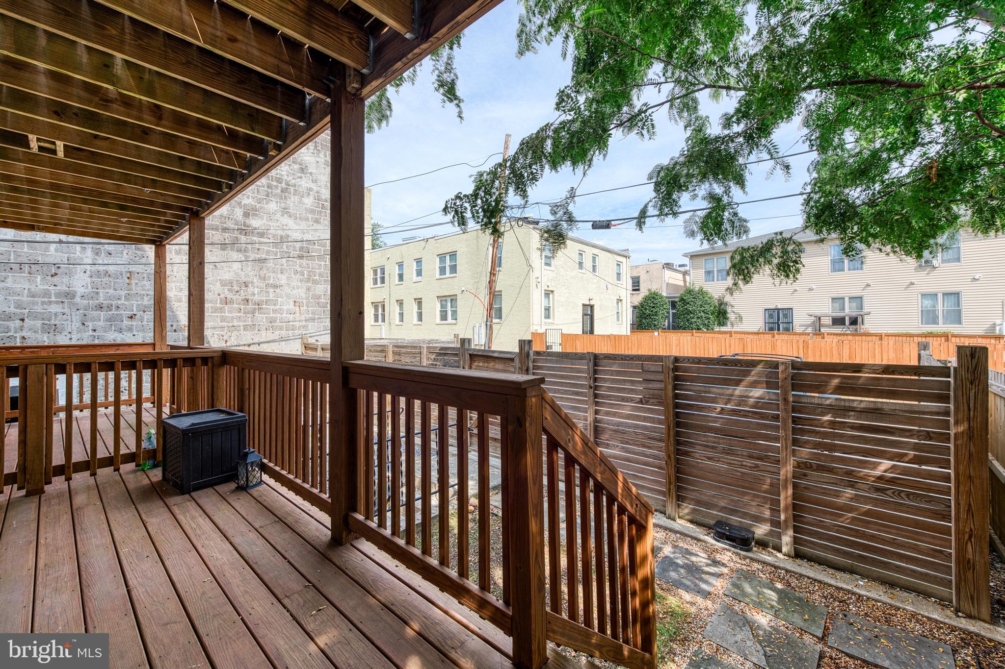 1812 D Street Northeast, Unit 1 Washington, DC 20002 - Photo 28 of 31 a view of a balcony with wooden floor and fence