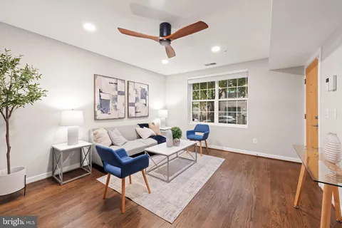 a living room with furniture and windows