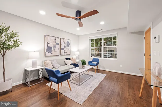 a living room with furniture and windows