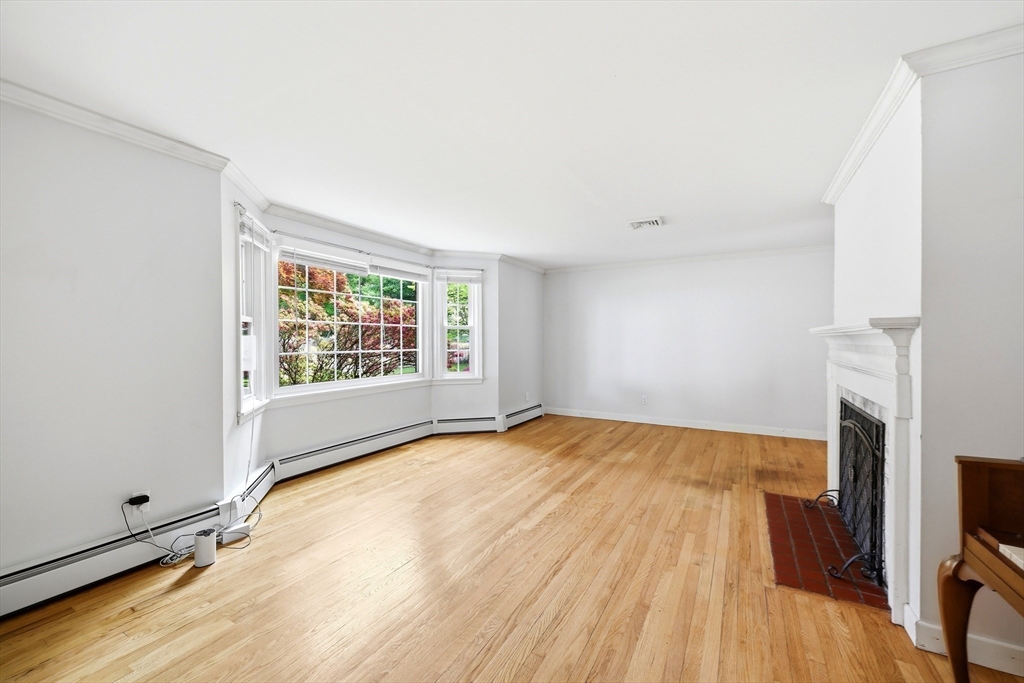 130 Connecticut Avenue Springfield, MA 01107 - Photo 25 of 40 a view of an empty room with wooden floor and a window