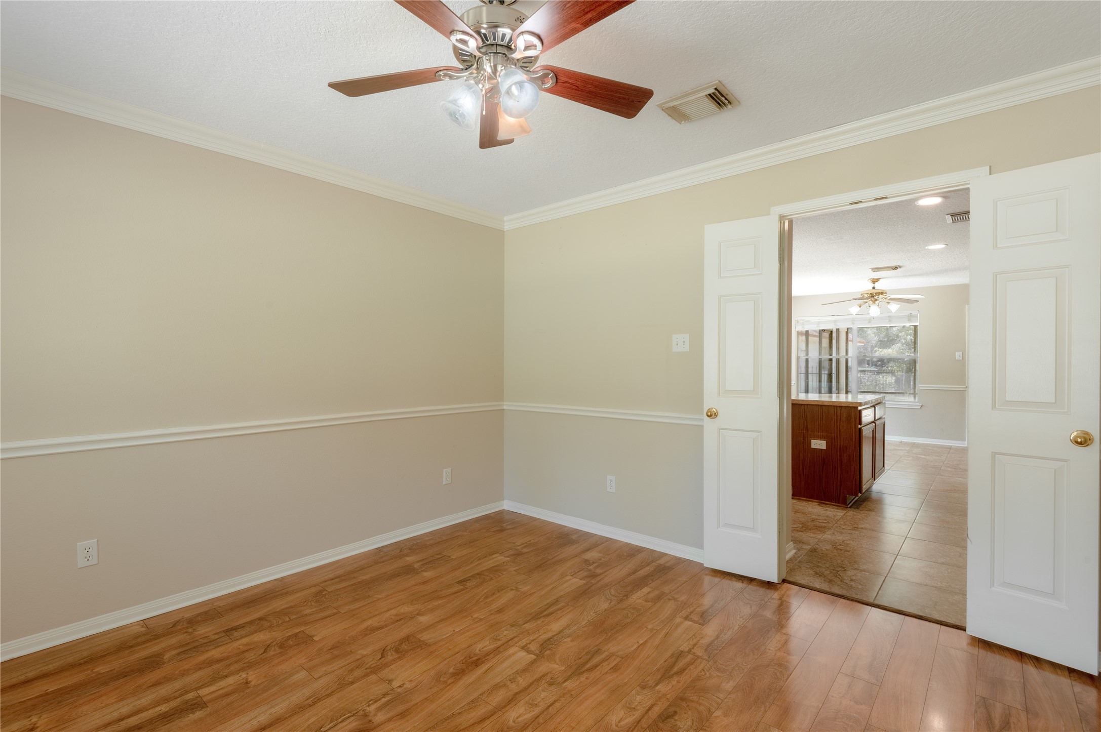 324 Red Oak Lane Trinity, TX 75862 - Photo 13 of 49 an empty room with wooden floor and windows