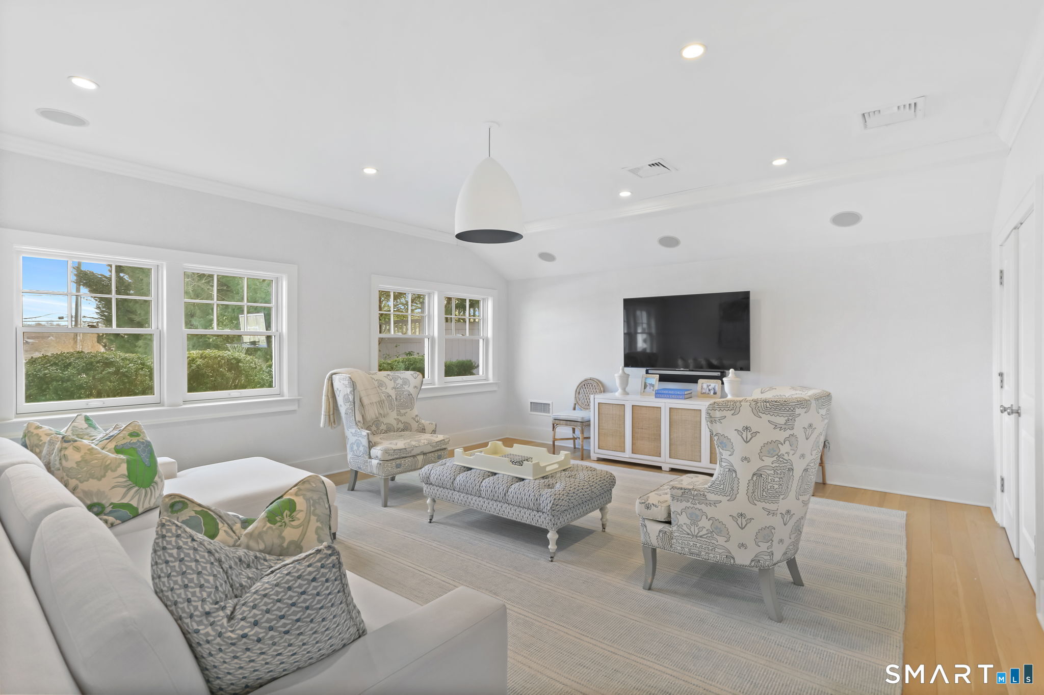 90 5 Mile River Road Darien, CT 06820 - Photo 12 of 35 a living room with furniture and a flat screen tv