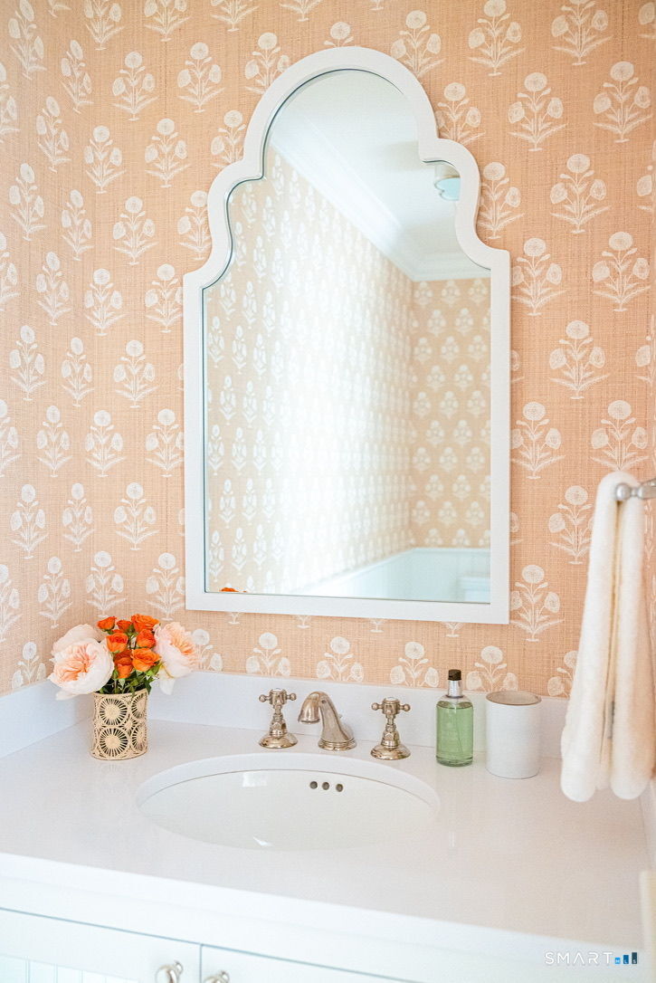 90 5 Mile River Road Darien, CT 06820 - Photo 17 of 35 a bathroom with a sink and a mirror