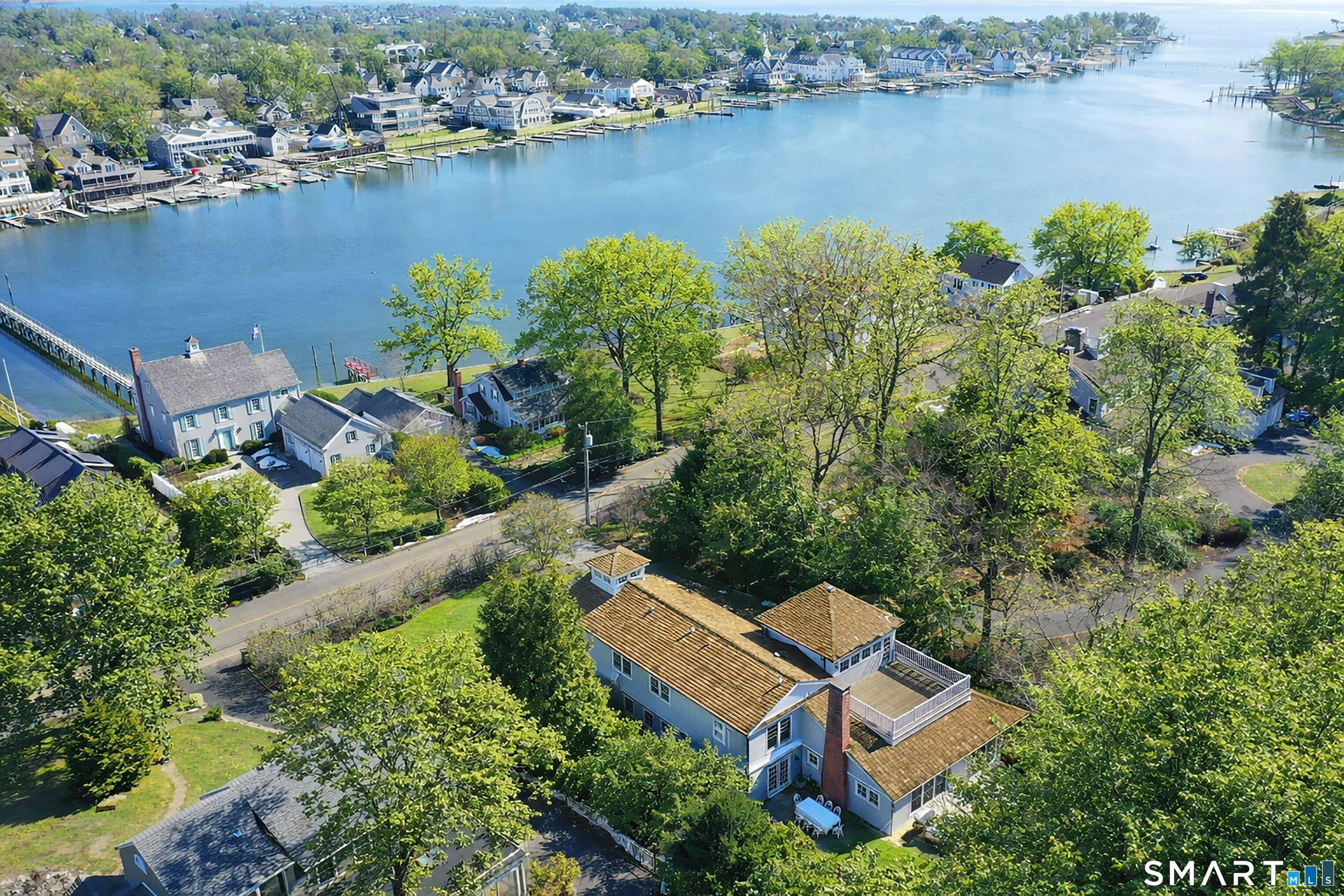 90 5 Mile River Road Darien, CT 06820 - Photo 2 of 35 an aerial view of a house with outdoor space and lake view