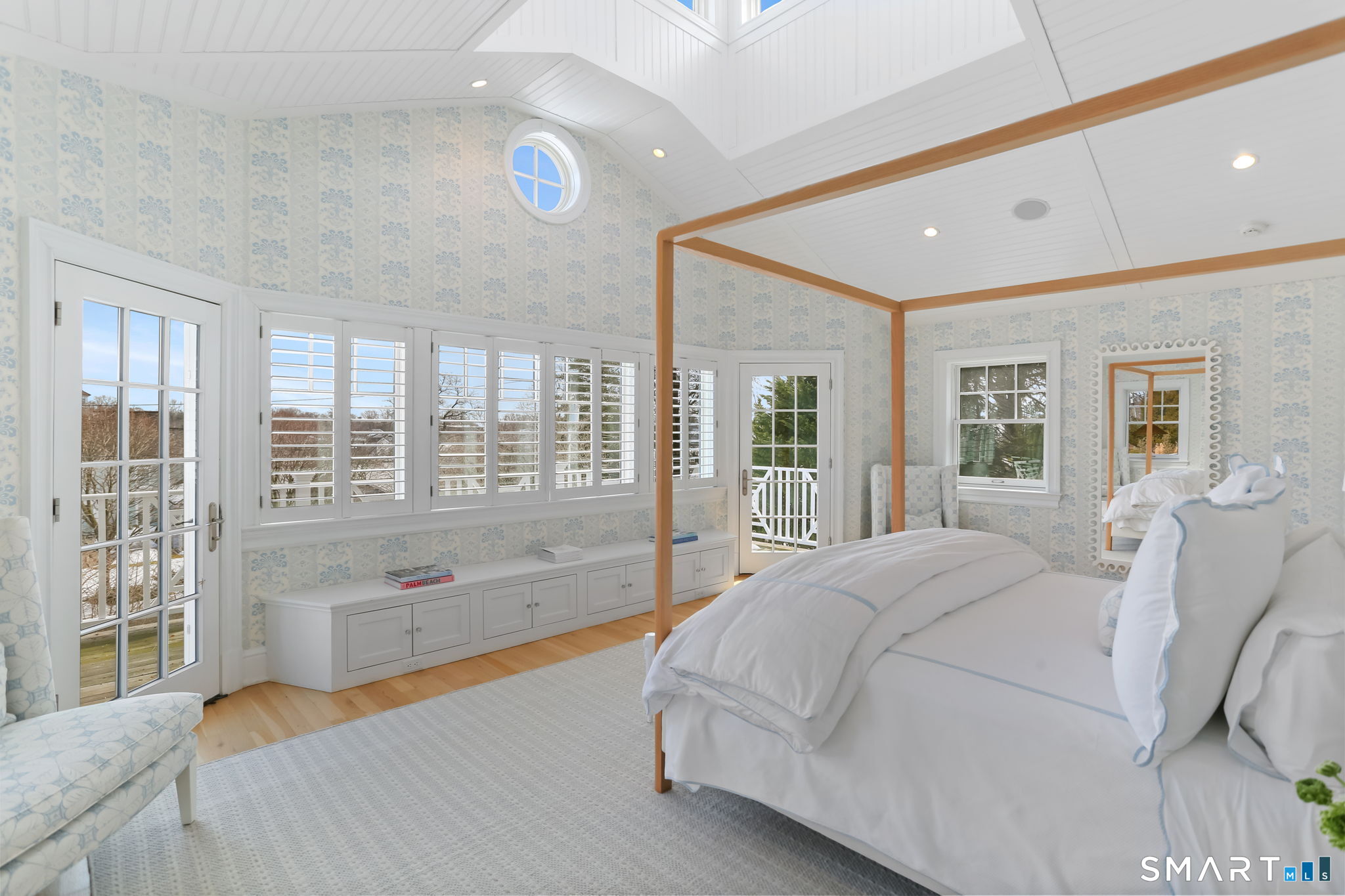 90 5 Mile River Road Darien, CT 06820 - Photo 26 of 35 a spacious bedroom with a large bed and a large window