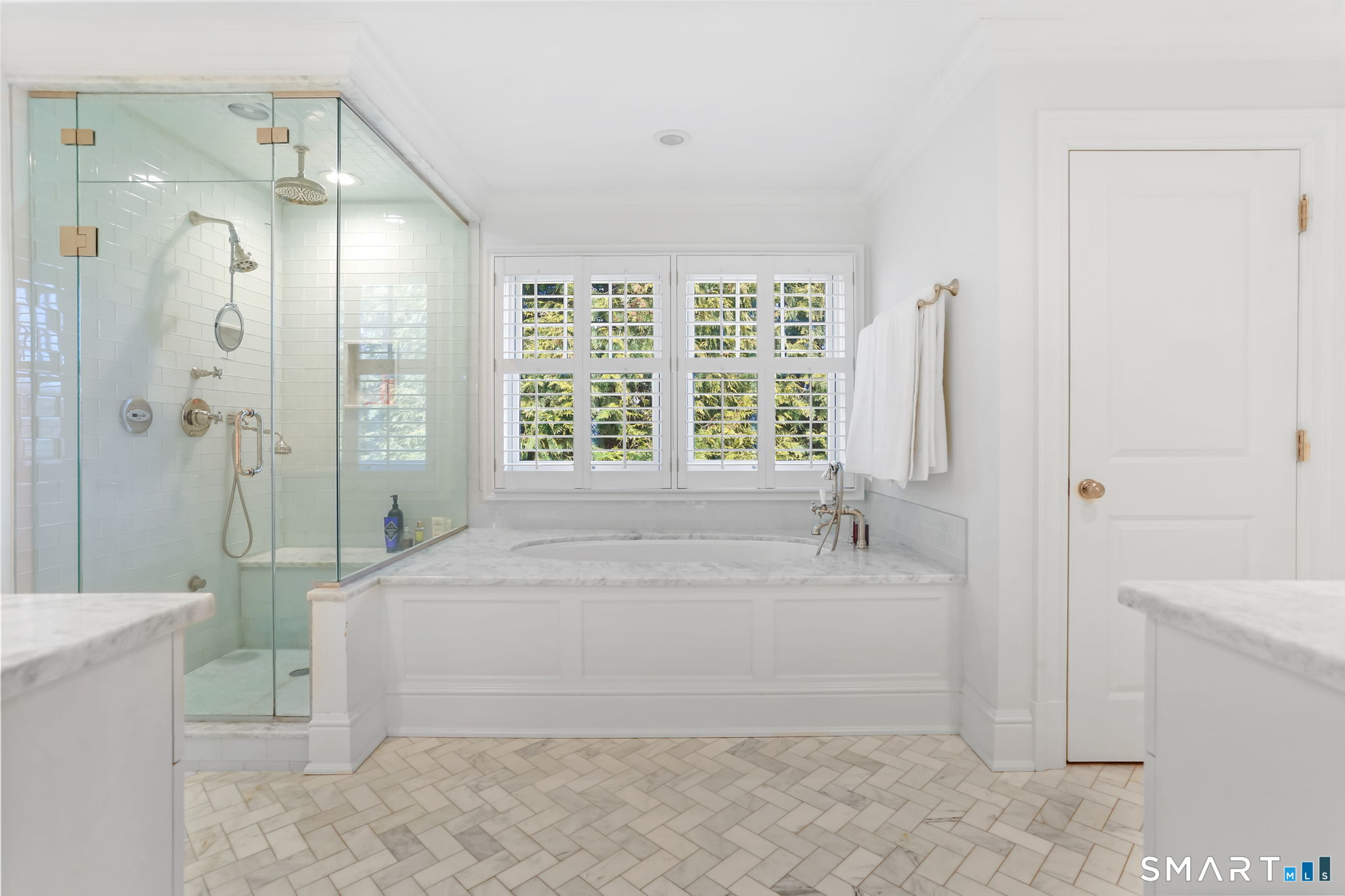 90 5 Mile River Road Darien, CT 06820 - Photo 27 of 35 a bathroom with a tub shower and sink