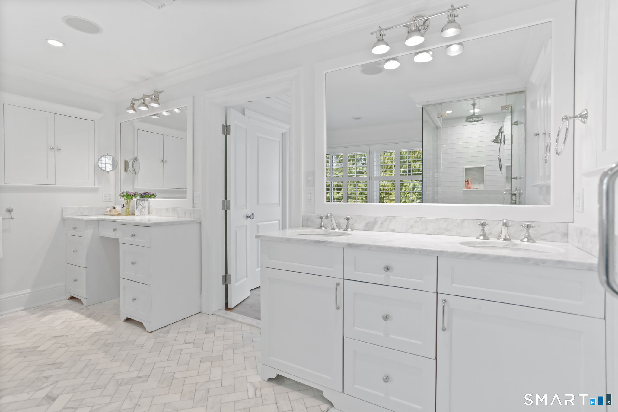 90 5 Mile River Road Darien, CT 06820 - Photo 28 of 35 a bathroom with a sink a light fixture a vanity and a large mirror